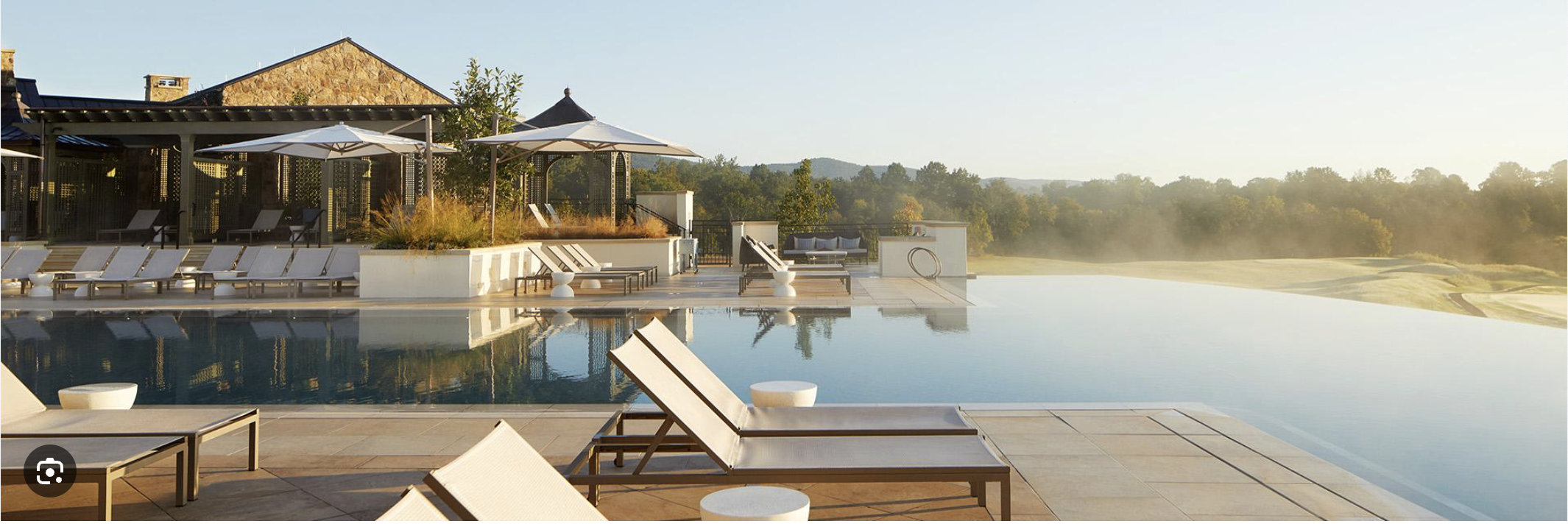 The pool terrace and pavilion at Keswick Hall at sunrise